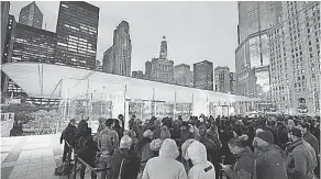  ??  ?? Customers wait in line Friday to buy the X at an Apple store in Chicago. APPLE