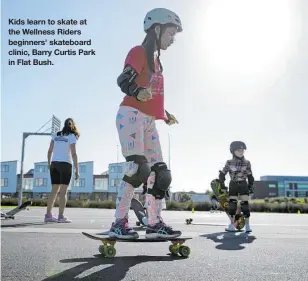  ??  ?? Kids learn to skate at the Wellness Riders beginners' skateboard clinic, Barry Curtis Park in Flat Bush.