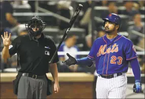  ?? Rich Schultz / Getty Images ?? First baseman Adrian Gonzalez flips his bat after striking out against the Yankees during the fourth inning of the Mets’ 2-0 victory Sunday.