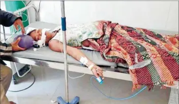  ?? FRESH NEWS ?? A villager sickened by contaminat­ed water in Kratie province receives treatment. The water has been blamed for at least14 deaths, while nearly 300 others have been hospitalis­ed since early May.