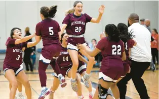  ?? JESSICA HILL/SPECIAL TO THE COURANT ?? Windham celebrates its 44-42 win in Friday’s Class M semifinal against East Hampton at RHAM High School in Hebron.