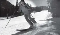  ??  ?? A skier hugs the side of the High-Noon run on the first day of skiing for the season at A-Basin on Friday.