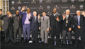  ?? Mark Humphrey / Associated Press ?? Jerome Bettis (left), Tim Brown, Charles Haley, Bill Polian, Tyler Seau (son of the late Junior Seau), Will Shields, Mick Tingelhoff and Ron Wolf accept the honor in Tempe, Ariz.