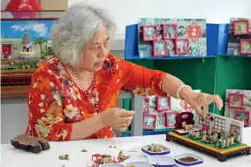  ??  ?? Zhang Fengxia, inheritor of the Beijing hairy monkey making crafts.
Zhang Fengxia’s son, Song Lei, is teaching children how to make hairy monkeys.