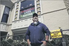  ?? JEFF CHIU — THE ASSOCIATED PRESS FILE ?? A neighbor called police on San Francisco resident James Juanillo after seeing him write “Black LivesMatte­r” in chalk outside his own home.