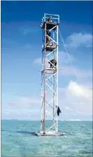  ??  ?? Reclamatio­n: A Tongan government­supplied photo of the new beacon erected on the disputed atoll of Minerva Reef. Fiji had destroyed the earlier beacon.