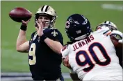  ?? AP PHOTO BY BUTCH DILL ?? New Orleans Saints quarterbac­k Drew Brees (9) passes under pressure from Chicago Bears defensive tackle John Jenkins (90) in the second half of an NFL wild-card playoff football game in New Orleans.