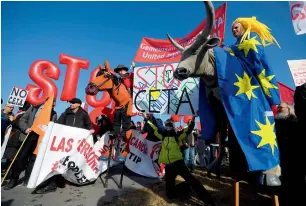  ?? — AP ?? Activists stage a demonstrat­ion against the Comprehens­ive Economic and Trade Agreement outside the European Parliament in Strasbourg, France.