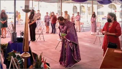  ?? (The New York Times/Philip Cheung) ?? The Rev. Jesus Zamarripa says the first of two funeral Masses for coronaviru­s victims at Our Lady of Lourdes Catholic Church in East Los Angeles on Feb. 27. “Everyone is suffering during the pandemic, but we need to support each other and we need to be more passionate with those around us” said Zamarripa, who was hospitaliz­ed with covid-19 last year.