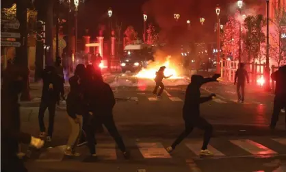 ?? ?? Protesters throw stones and flares at gendarmes in Ajaccio. Photograph: Pascal Pochard-Casabianca/AFP/Getty Images