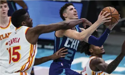  ?? Photograph: Jacob Kupferman/AP ?? Charlotte Hornets guard LaMelo Ball finished with 22 points, 12 rebounds and 11 assists in Saturday’s win over the Atlanta Hawks.