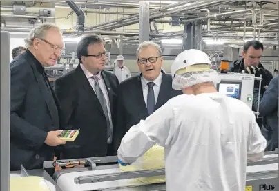  ?? SUBMITTED ?? Premier Wade MacLauchla­n, left, Abe Buttimer, president of ADL’s board, and federal Agricultur­e Minister Lawrence MacAulay tour the ADL plant in Summerside on Monday. The Summerside dairy processing plant is receiving millions in federal funds to...