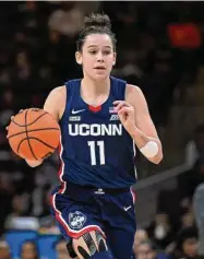  ?? Terrance Williams/Associated Press ?? UConn forward Lou Lopez Senechal brings the ball upcourt during the first half game against Georgetown on Feb. 11 in Washington.