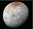  ?? THE ASSOCIATED PRESS ?? An entire half of the moon Charon looks to have been resurfaced.
