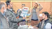  ??  ?? Polling staff counts the votes of urban local body elections of J&K for 52 civic bodies, at a Counting Centre in Srinagar on Saturday