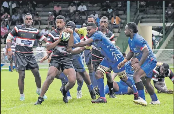  ?? Picture: REINAL CHAND ?? Naitasiri’s Motikiai Murray looks for support as Yasawa defence comes in during their match in the Skipper Cup competitio­n at Prince Charles Park in Nadi yesterday.
