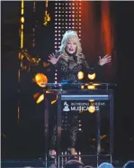  ?? ( Gina Ferazzi/ Los AngelesTim­es/ TNS) ?? DOLLY PARTON speaks to the crowd as the honoree for MusiCares’ Person of the Year in Los Angeles, last year.