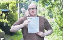  ?? PHOTO: PETER MCINTOSH ?? Still not buying it . . . Dunedin homeowner Sam Sharpe says a ‘‘threatenin­g’’ letter from the Dunedin City Council will not change his mind about who should pay for repairs to a leaking water toby.