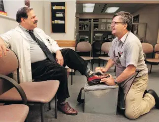  ??  ?? Dr. Samuel Kocoshis, left, says his Oxford shoes had a standing Friday date with Albert Lexie during the 1980s and ’90s at the UPMC Children’s Hospital of Pittsburgh. BILL WADE / PITTSBURGH POST-GAZETTE VIA THE ASSOCIATED PRESS