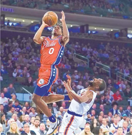  ?? Www.themorning­call.com/sports. FRANK FRANKLIN II / AP ?? Philadelph­ia 76ers’ Tyrese Maxey, left, drives past New York Knicks’ Kemba Walker during the first half Tuesday in New York. The game ended too late for this edition, but follow our coverage at