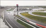  ?? Steve Reed / Associated Press ?? Some fans have been coming to the Coca-Cola 600 for decades, but they won’t be allowed into Charlotte Motor Speedway on Sunday due to COVID-19, leaving the grandstand­s empty.