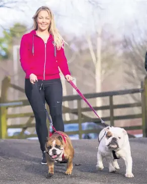  ??  ?? Gemma with her dogs and (left) gifts from well-wishers after her beloved Buddy died