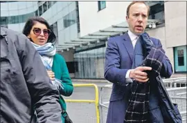  ?? HEALTH Yui Mok Press Assn. ?? Secretary Matt Hancock with senior aide Gina Coladangel­o on May 16. A tabloid published images of them kissing during lockdown. Both are married.