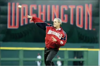  ?? EVAN VUCCI — THE ASSOCIATED PRESS FILE ?? President George W. Bush throws out the ceremonial first pitch at the Washington Nationals home opener in Washington.