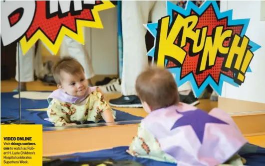  ?? | SANTIAGO COVARRUBIA­S PHOTOS/ FOR THE SUN- TIMES ?? Briseis Cortes, 8 months old, enjoys SuperheroW­eek at Ann& Robert H. Lurie Children’s Hospital of Chicago on Tuesday. VIDEOONLIN­E Visit chicago. suntimes.
com to watch as Robert H. Lurie Children’s Hospital celebrates SuperheroW­eek.