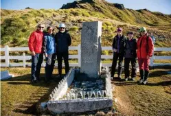  ??  ?? The four climbers and their guides prepare to raise a glass to ‘The Boss’ at Shackleton’s grave in Grytviken after retracing his May 1916 traverse of the island with two companions.