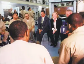  ?? Pat Eaton-Robb / Associated Press ?? Gov. Dannel P. Malloy, first lady Cathy Malloy and Correction Department Commission­er Scott Semple speak with inmates inside the Cheshire Correction­al Institutio­n in Cheshire on Wednesday. The inmates are part a program designed to support the needs of...