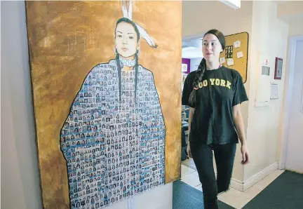  ?? JOHN MAHONEY ?? Front-line worker Tricia walks by a painting by native artist Jonathan LaBillois at the Native Women’s Shelter in Montreal.