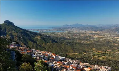  ??  ?? The view fron Baunei towards the Ogliastra lowland plains. Photograph: INTERFOTO/Alamy Stock Photo