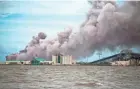  ?? ANDREW CABALLERO-REYNOLDS/AFP VIA GETTY IMAGES ?? Smoke rises from a fire at a chemical plant Thursday after Hurricane Laura blew through Lake Charles, La.