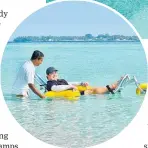 ?? ?? A guest using the floating wheelchair at Amilla Maldives Resort; top, the resort is on track to becoming the world’s first Inclucare-certified resort. Photos / Supplied