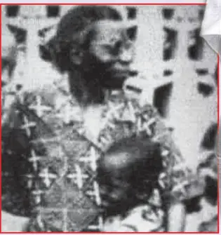  ??  ?? Adegbola as a toddler with grandfathe­r, the late Chief Ajibola Ige