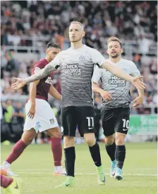  ??  ?? Marcus Maddison after scoring from the penalty spot.