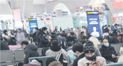  ?? Pictures: AFP ?? GOING HOME. People at Shijiazhua­ng train station on Tuesday as millions of Chinese are making their way to their home towns to celebrate the Lunar New Year with family on Saturday.