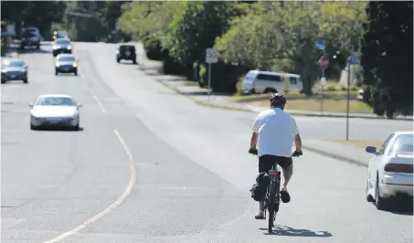  ??  ?? A cyclist travels along Richardson Street, near Foul Bay Road, on Thursday.