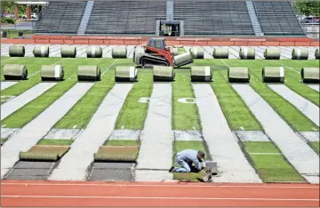  ??  ?? Above: Artificial turf is being removed from Barron Stadium in advance of the installati­on of a new artificial surface.