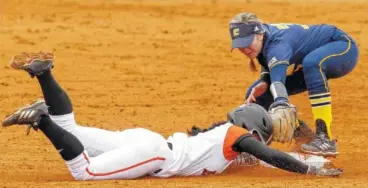  ??  ?? UTC’s J.J. Hamill tags out Mercer’s Laurenne Sanchez at second base during their game.