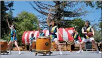  ?? PHOTO BY SHELDON HAMBRICK ?? A taiko group performs at Cupertino's Cherry Blossom Festival, held April 30-May 1at Memorial Park. Cupertinot­oyokawa Sister Cities Inc. holds the annual festival to honor Cupertino's sister city of Toyokawa, Japan by sharing Japanese culture with the community.