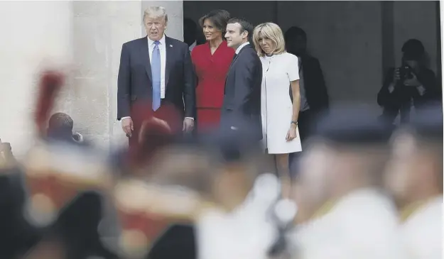 ?? PICTURE: YVES HERMAN/AP ?? 0 Mr Macron and his wife Brigitte met Mr Trump and First Lady Melania Trump at Les Invalides ahead of the Bastille Day French holiday today