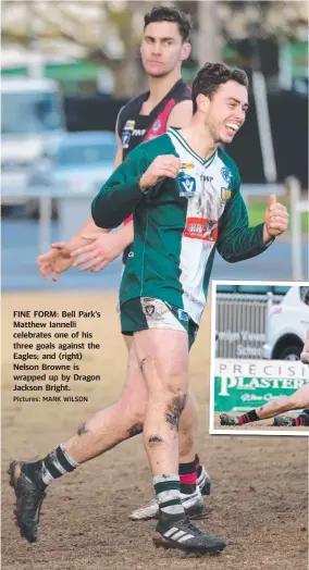  ?? Pictures: MARK WILSON ?? FINE FORM: Bell Park‘s Matthew Iannelli celebrates one of his three goals against the Eagles; and (right) Nelson Browne is wrapped up by Dragon Jackson Bright.