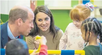  ?? ?? William and Kate met the Mucktubs children, who were keen to show them their work.