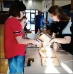  ??  ?? Left: Ashworth Middle School hosts a Creative Discovery Museum STEM and Literacy Family Night. A reading tent is set up for the Creative Discovery Museum STEM and Literacy Family Night.