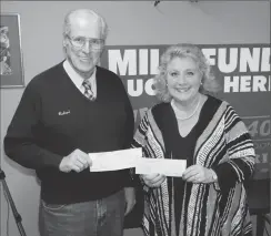  ?? Photo by Joseph B. Nadeau ?? Richard Picard, a retired vocational teacher and member of the local Morning Star Lodge of the Masons, presents a check for $1,000 from the Royal Arch Chapter authorized by Pawtucket’s Chapter No. 4 of the Masons, and another $1,000 check from the...