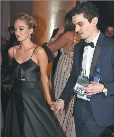  ?? KEVIN WINTER / GETTY IMAGES / AFP ?? Actress Olivia Hamilton and director Damien Chazelle attend the 74th Annual Golden Globe Awards in Beverly Hills, California.