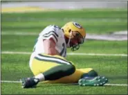  ?? JEFF HAYNES — THE ASSOCIATED PRESS FILE ?? In this file photo, Green Bay Packers quarterbac­k Aaron Rodgers (12) lies on the ground after being hit by Minnesota Vikings outside linebacker Anthony Barr during an NFL football game in Minneapoli­s. Everyone is wondering why there have been so many...