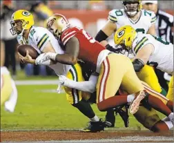  ?? Ben Margot Associated Press ?? DeFOREST BUCKNER makes one of the five sacks of the Green Bay Packers’ Aaron Rodgers in the San Francisco 49ers’ 37-8 victory Sunday.